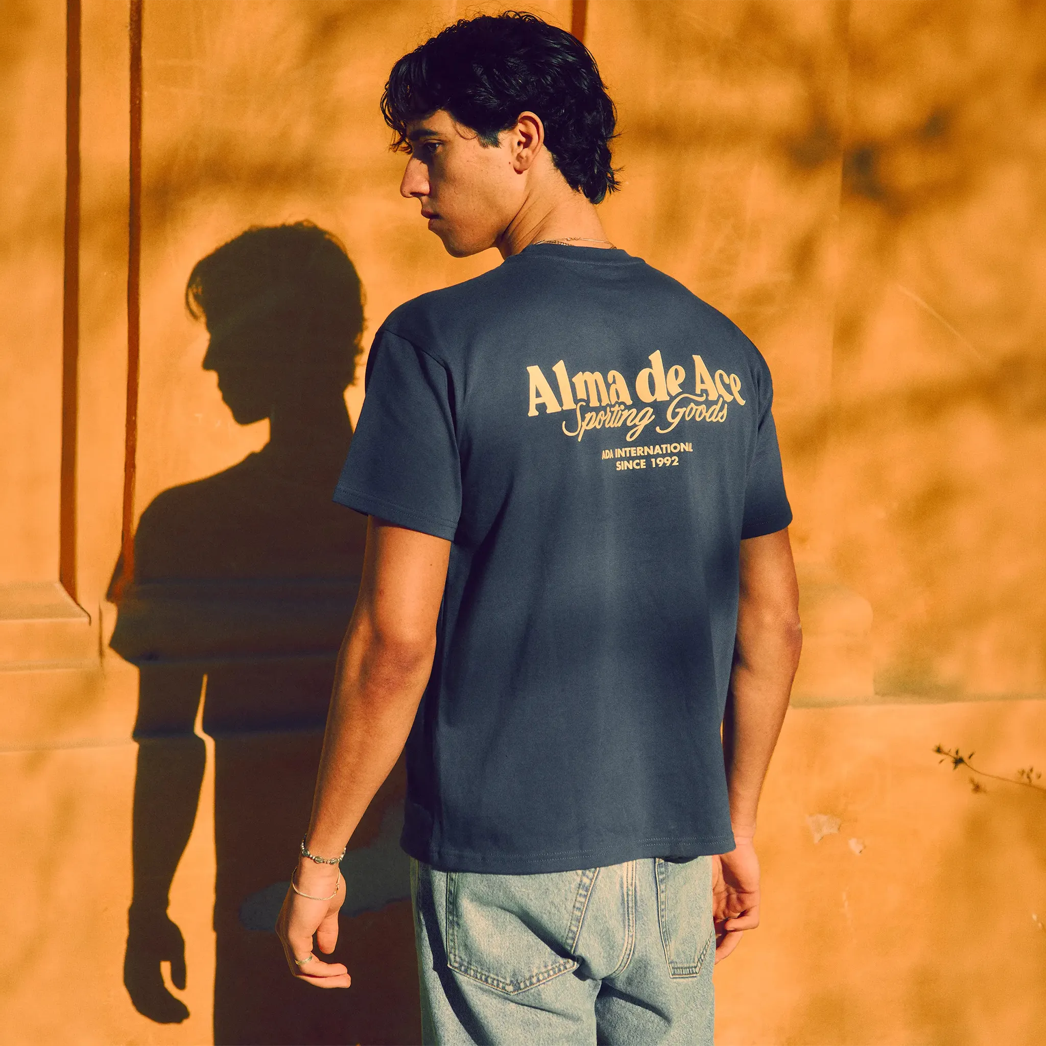 Front Model View of Alma De Ace Sporting Goods Midnight Blue T-Shirt